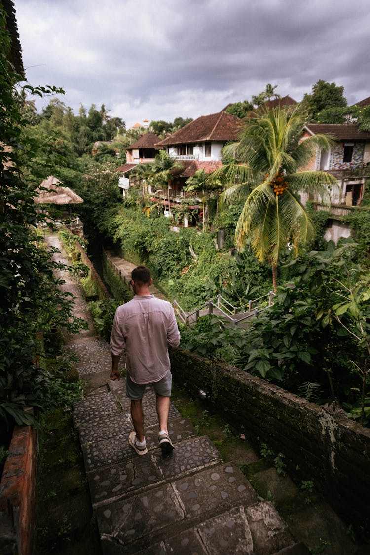 A Man Walking Down The Stairs