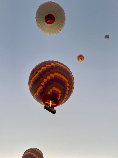 Low Angle Shot of Hot Air Balloons on the Background of Blue Sky 
