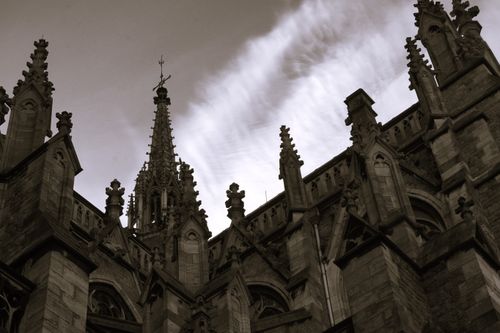 Free Captivating low angle view of Gothic architecture facade showcasing detailed spires and intricate designs. Stock Photo