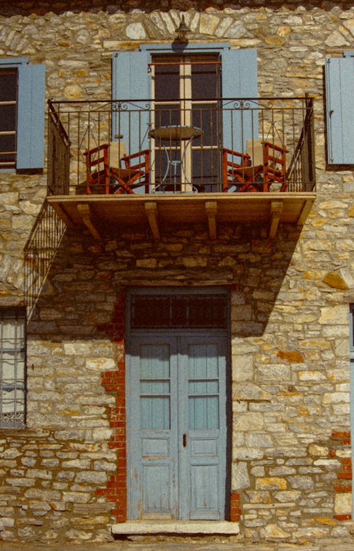 A Wooden Door and Balcony at the House