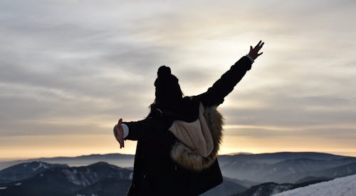 Back View of a Woman with Arms Outstretched