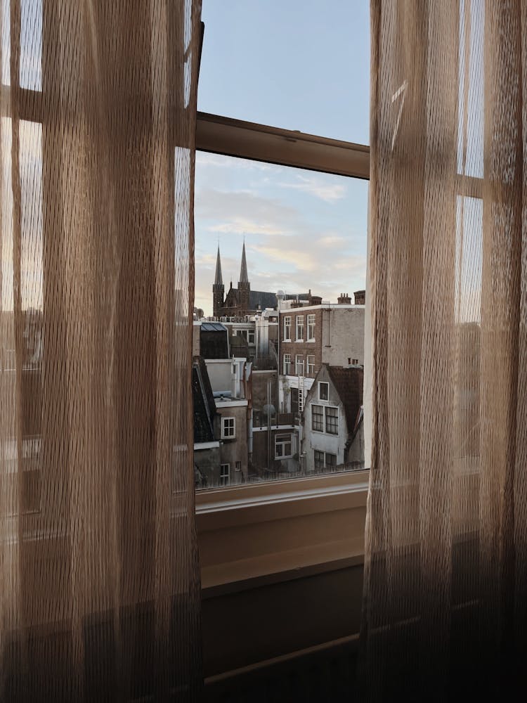 Cityscape Seen Through Apartments Window