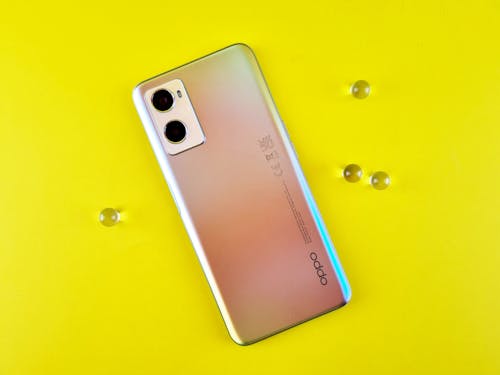 Photo of a Smartphone on a Yellow Background