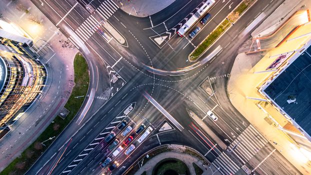 Dynamic aerial photograph showcasing a bustling city intersection with vibrant activity.