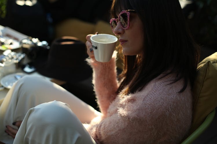 Woman Drinking From Ceramic Cup