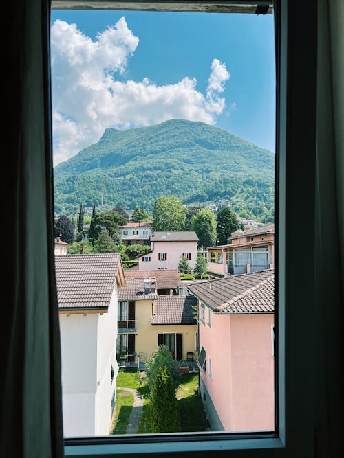 Houses and Hill Through the Window