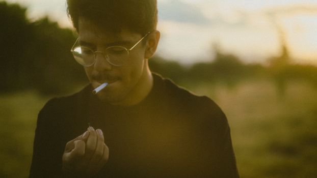 Close Up Photo of Man Smoking Cigarette