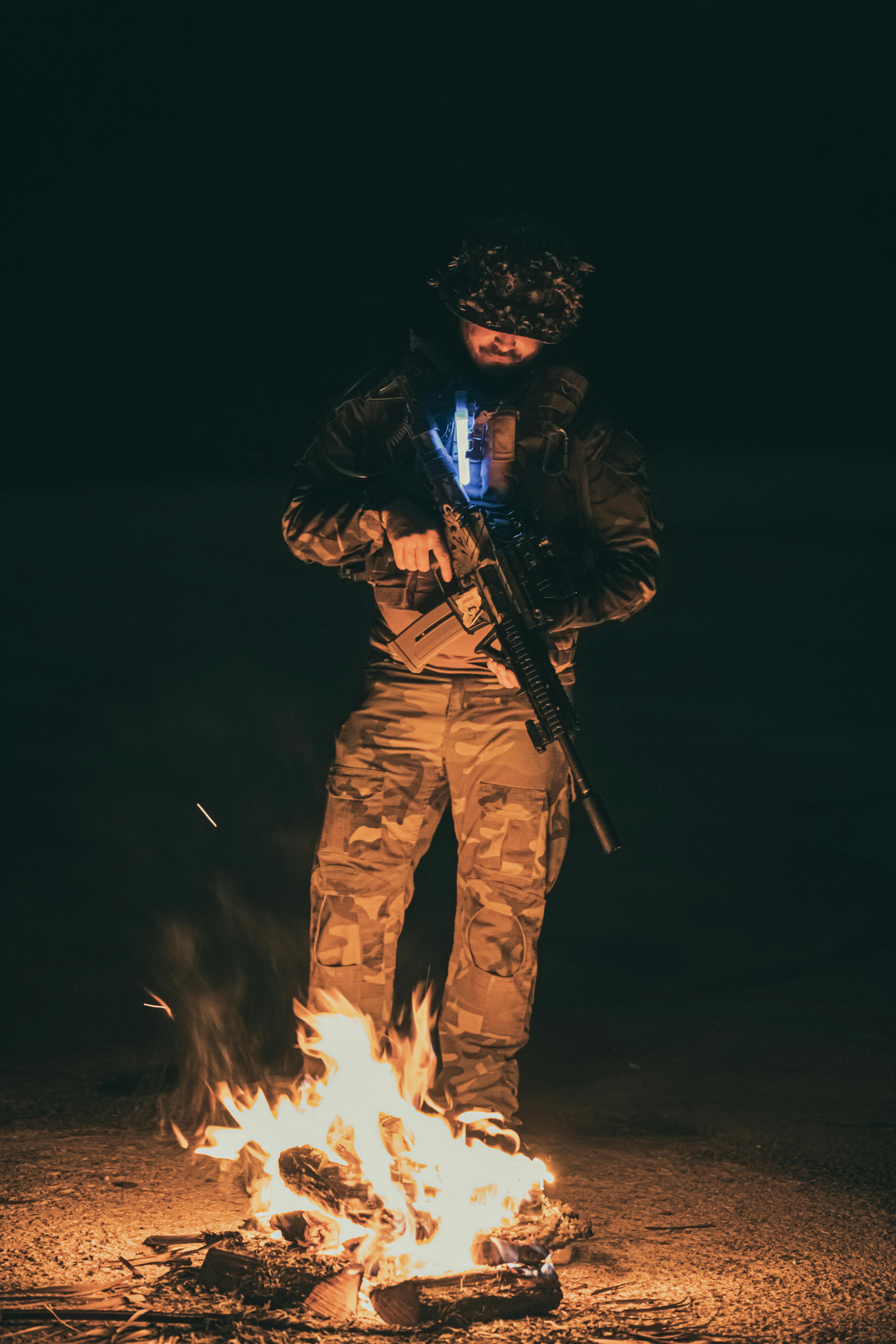 Soldier near Bonfire at Night · Free Stock Photo