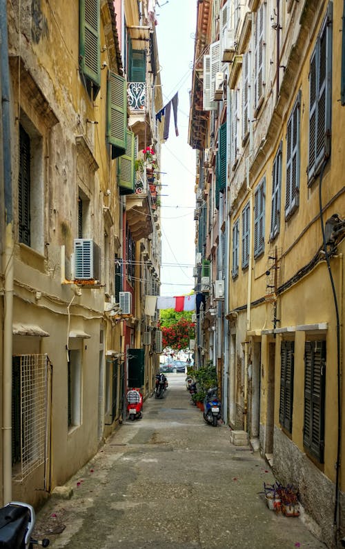 Narrow Alleyway Between Concrete Buildings