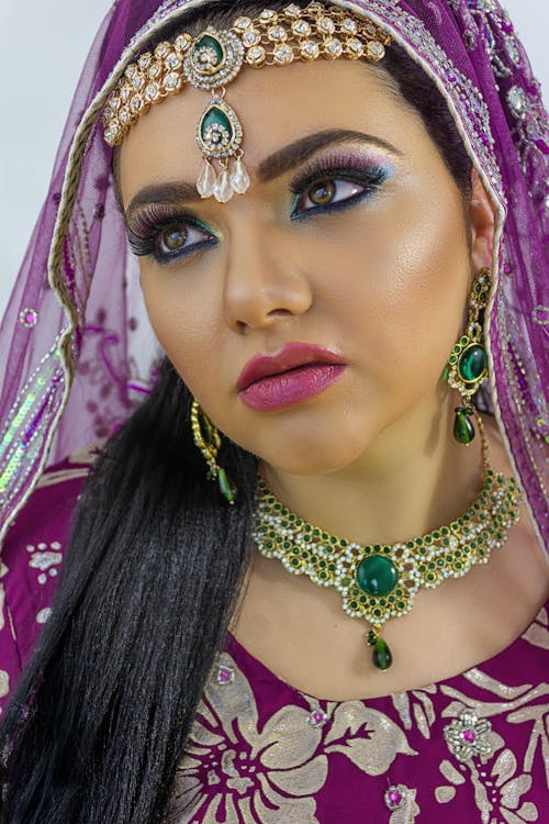 Woman in Glamour Make-Up Wearing Traditional Clothes