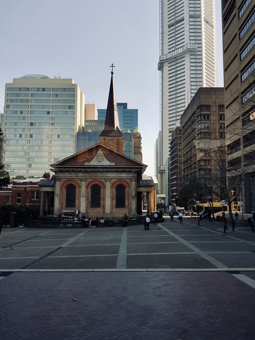 Free Historic St. James Church amidst modern skyscrapers in Sydney, Australia. Stock Photo