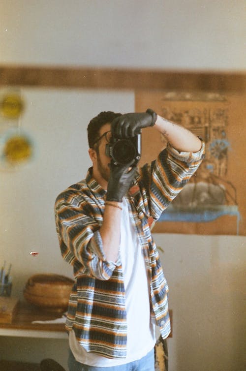 Reflection of a Man Taking a Picture