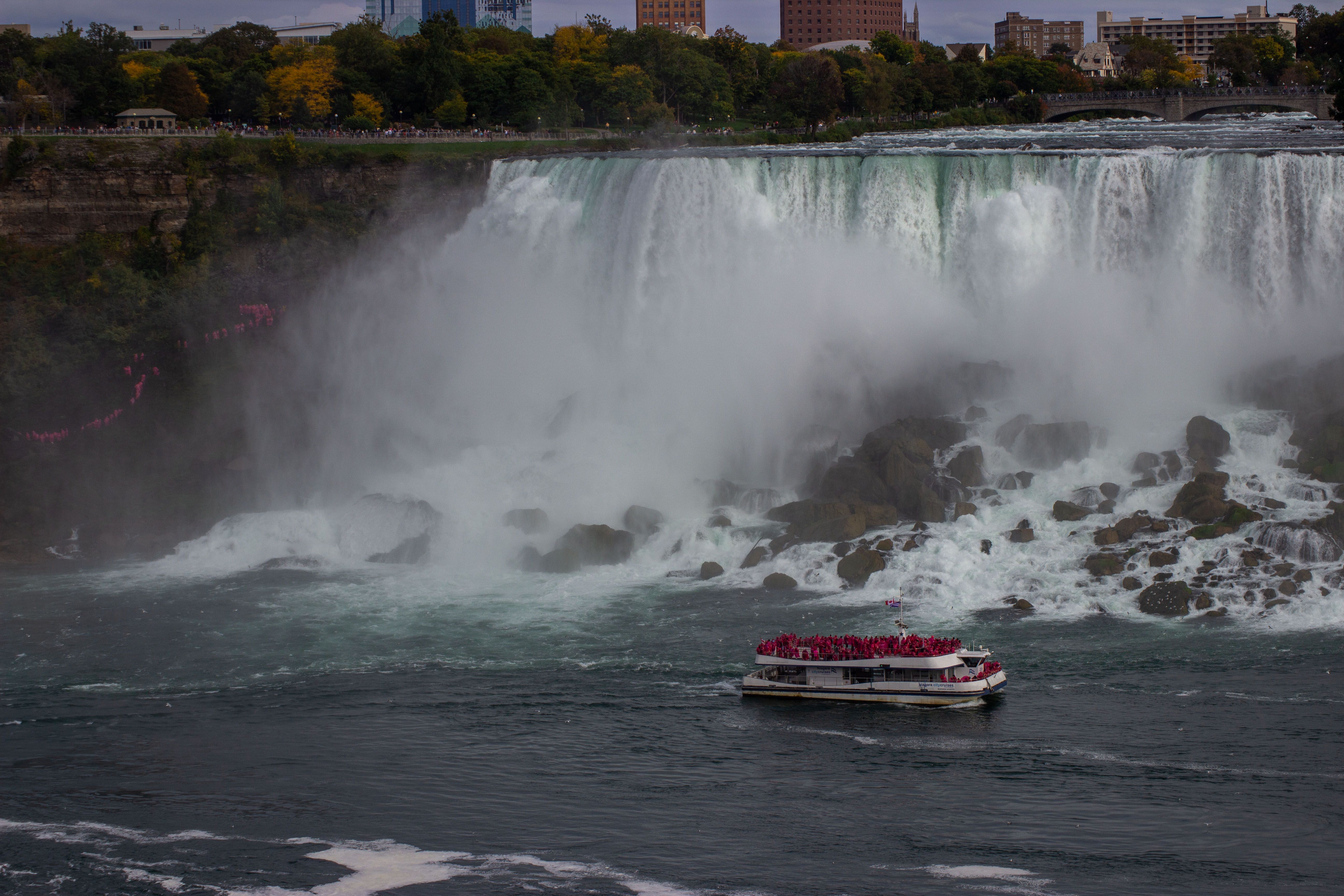 A boat full of tourists near the stunning Niagara Falls, Ontario, Canada.