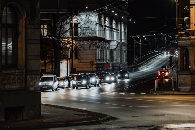 Cars On Road At Night Time