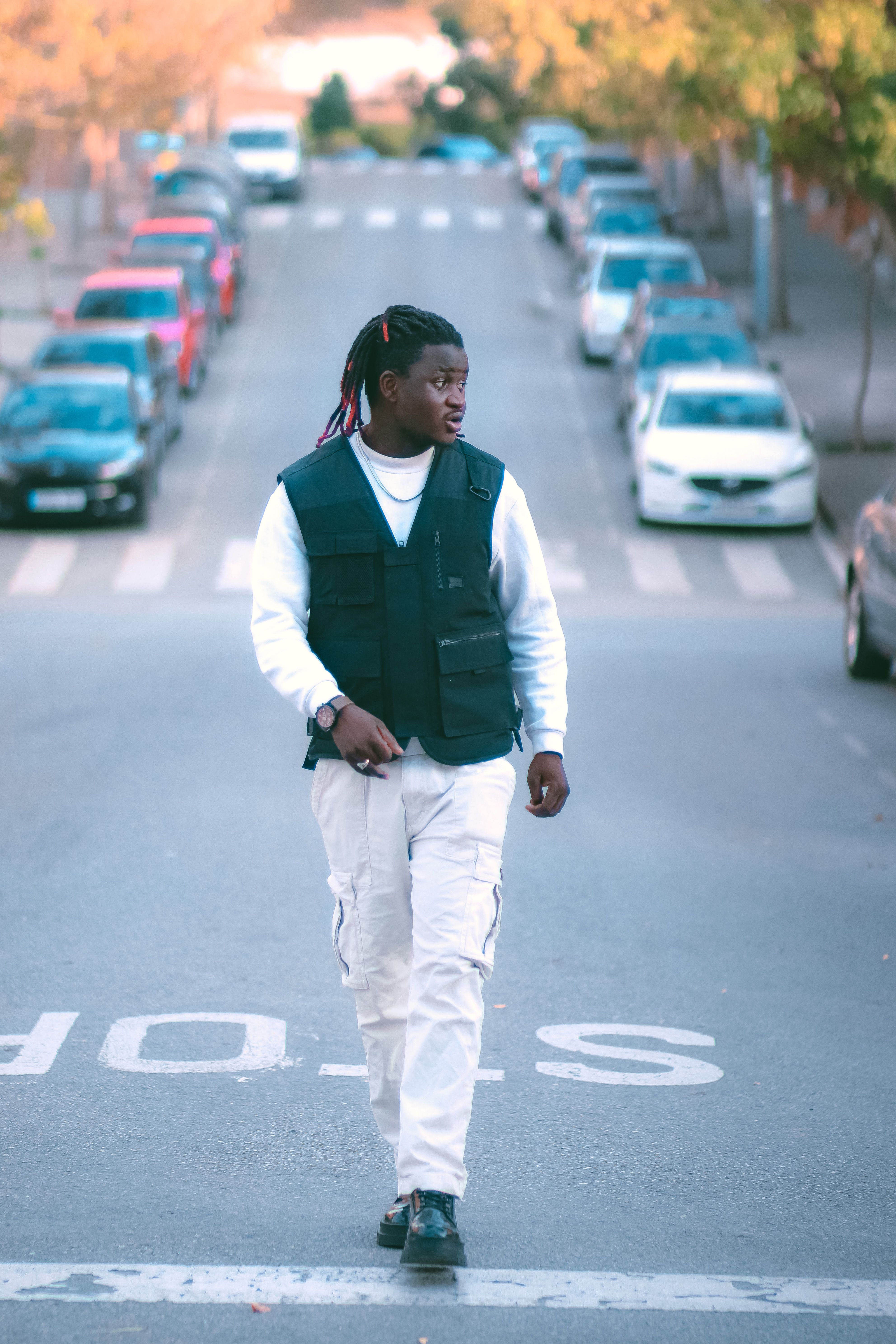 A Man Wearing Black Vest and White Pants · Free Stock Photo
