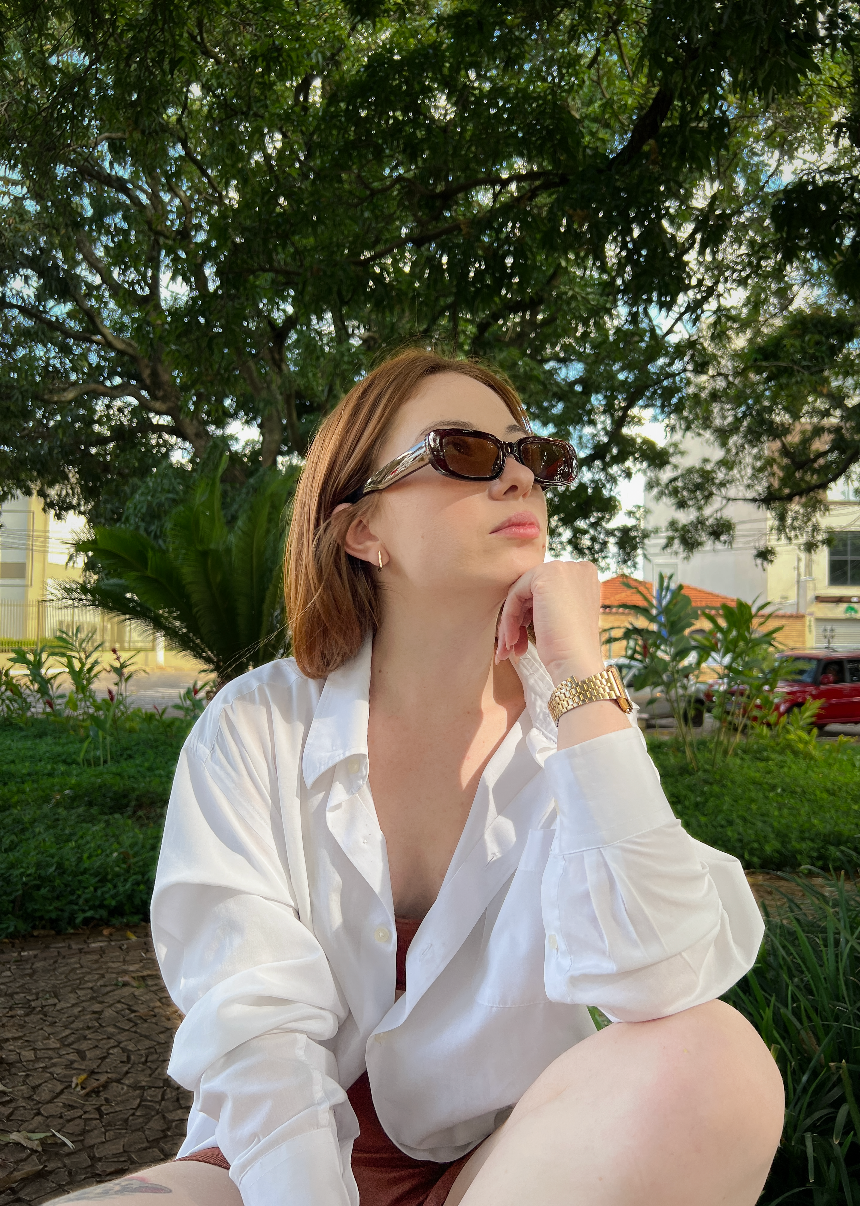 A Woman in White Long Sleeve Shirt Sitting on the Ground · Free Stock Photo