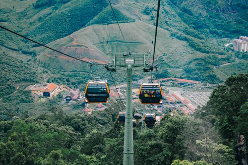 Free Scenic cable cars over lush mountains in Da Nang, Vietnam. Stock Photo