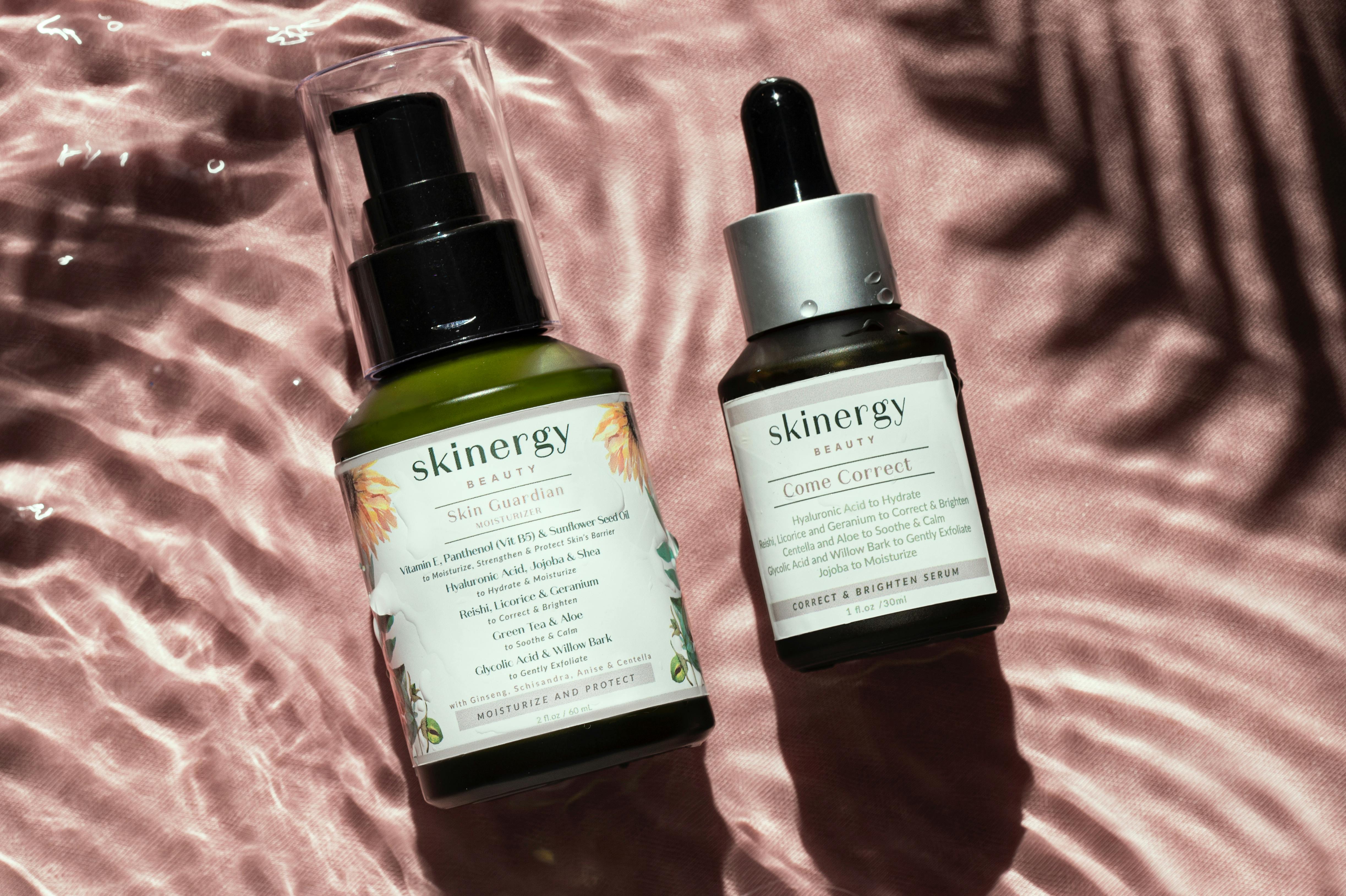 A collection of anti-aging skincare products specifically for dry skin, including serums, creams, and sunscreens