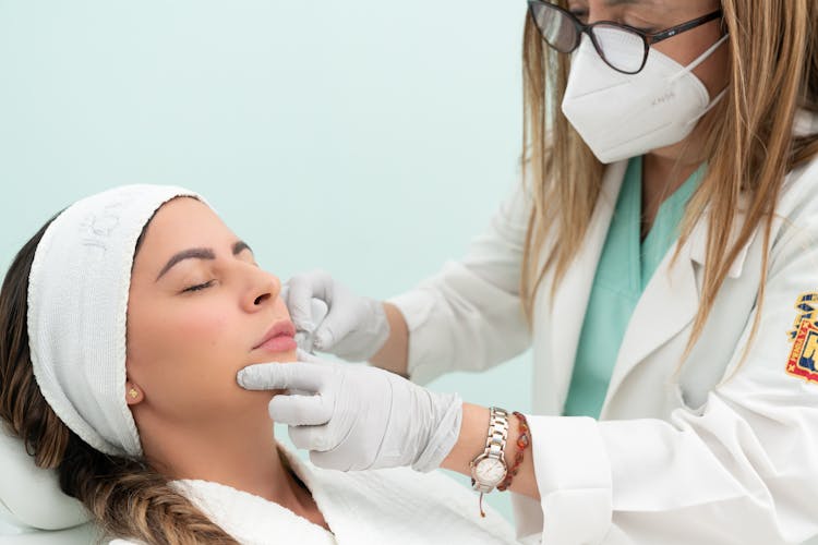 Faces Of Doctor In Mask And Patient