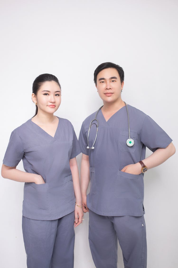 Portrait Of Doctors In Medical Aprons