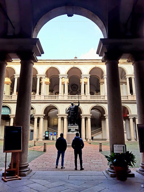 A Person Standing Near Statue