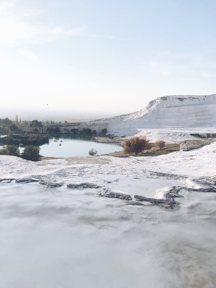 White Calcium Limestone Landscape And Thermal Pool In Pamukkale, Denizili, Turkey