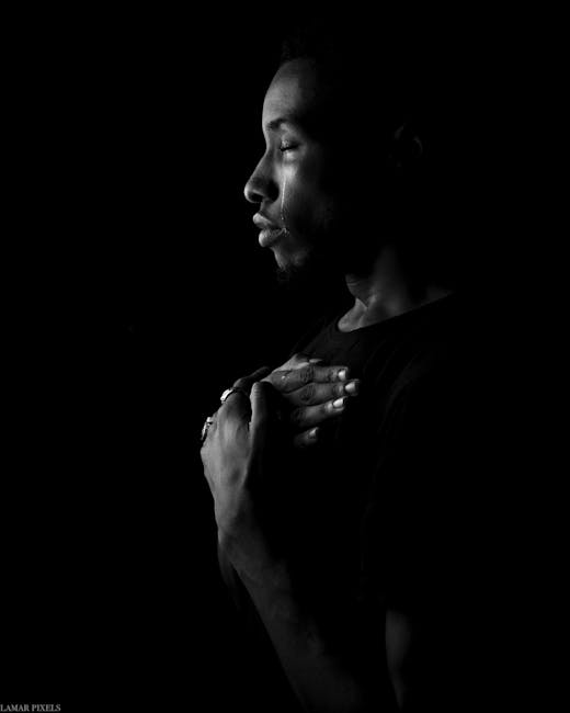 Expressive black and white portrait capturing deep emotion and introspection.