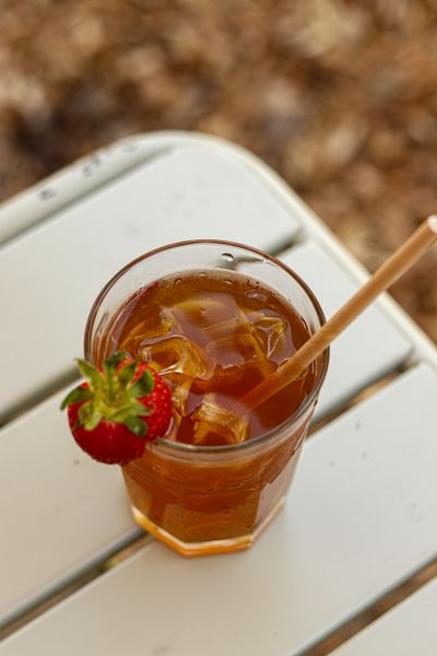 Iced tea with a strawberry on the rim — photo by Melodie Lochon on Pexels
