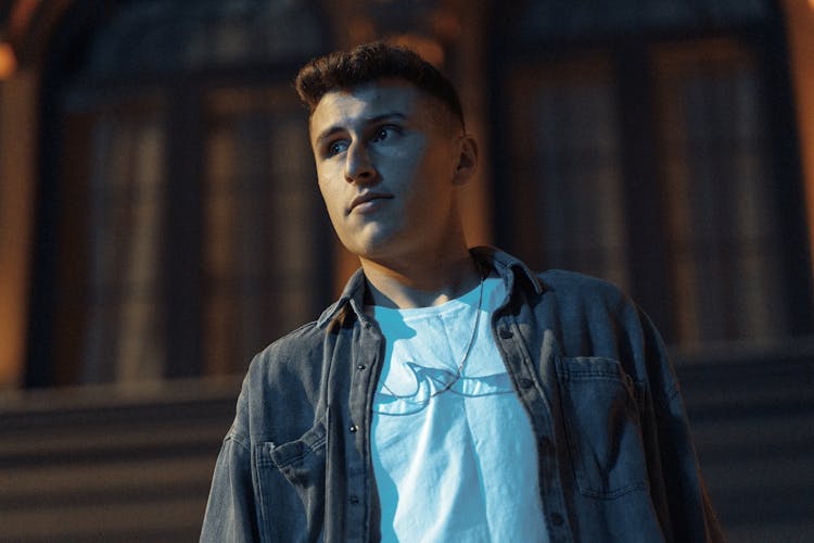 Low Angle Shot Of Man In Denim Button Up Jacket