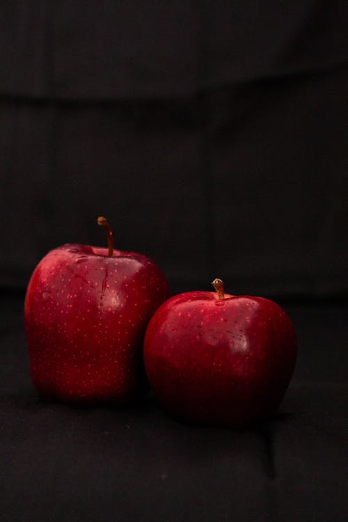 Red Apples on Black Surface