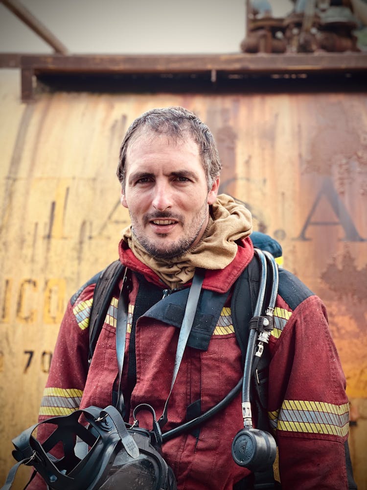 Firefighter Wearing A Red Jacket Uniform