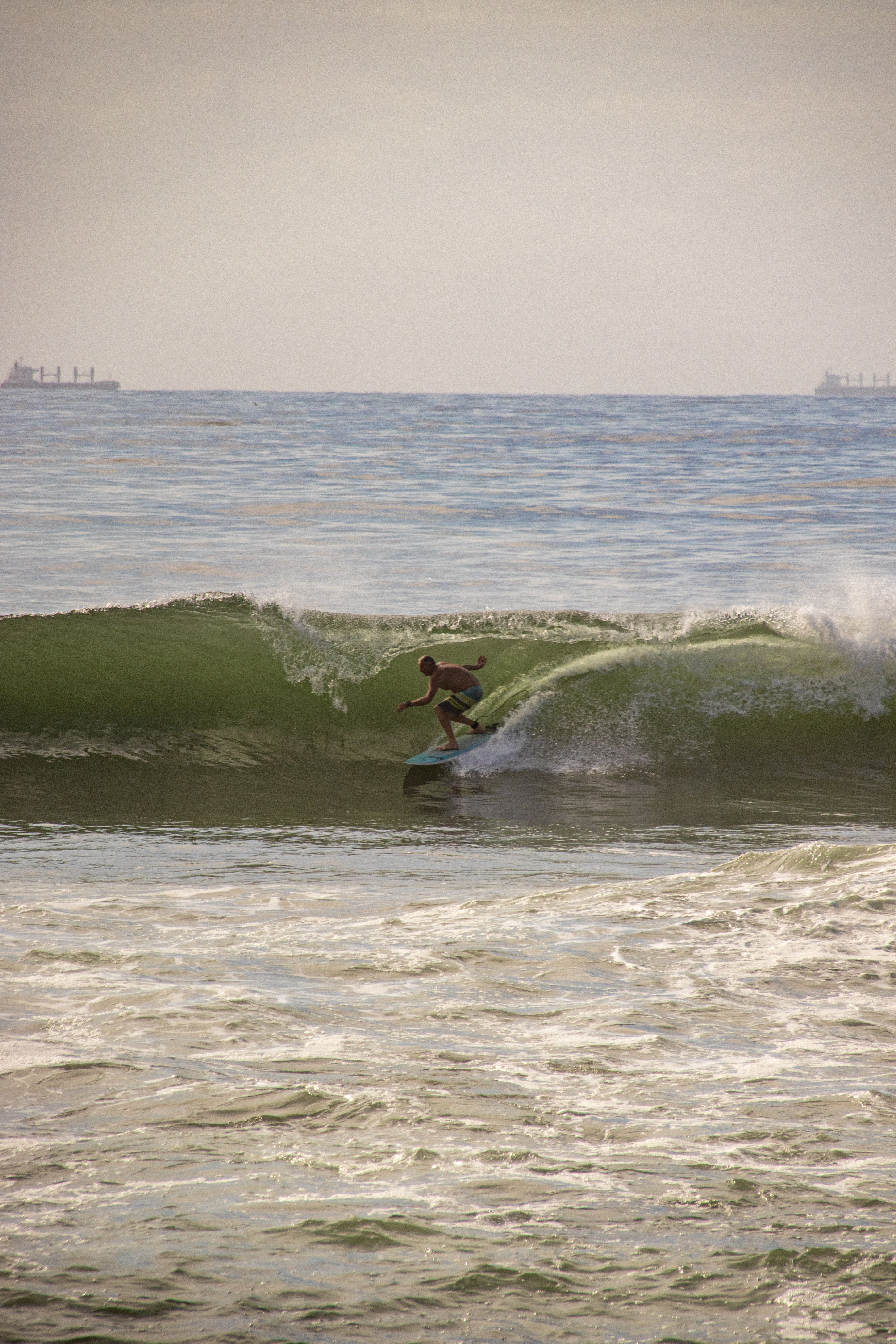 A Person Catching Wave on a Surf Board · Free Stock Photo