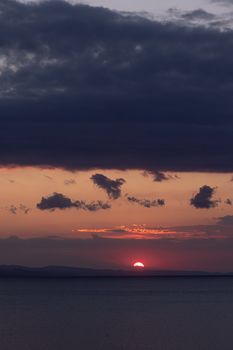 Stunning sunset view with vibrant sky and calm ocean, capturing the essence of twilight beauty.