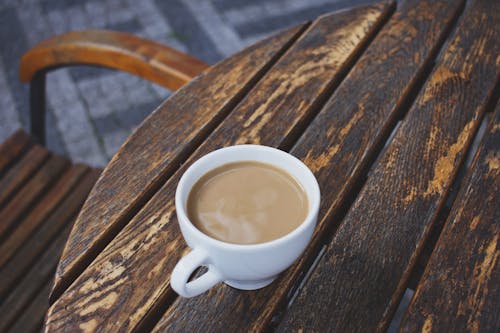 Free Coffee Cup on Wooden Table Stock Photo