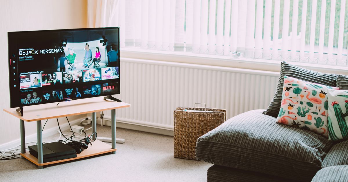 A flat-screen smart television switched on in a living room.
