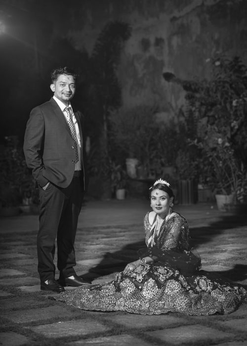 Free A classic black and white wedding photo showcasing a couple's special day. Stock Photo