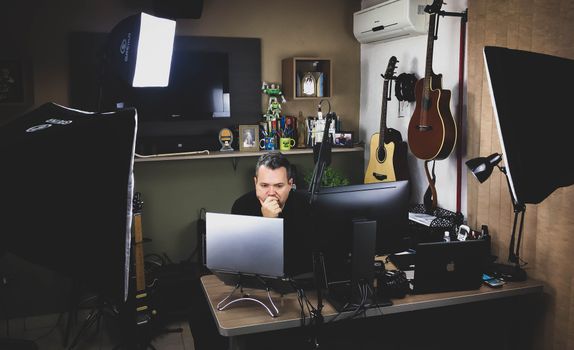 Modern music studio with guitars, computers, and lighting equipment. Ideal for creativity and technology themes.