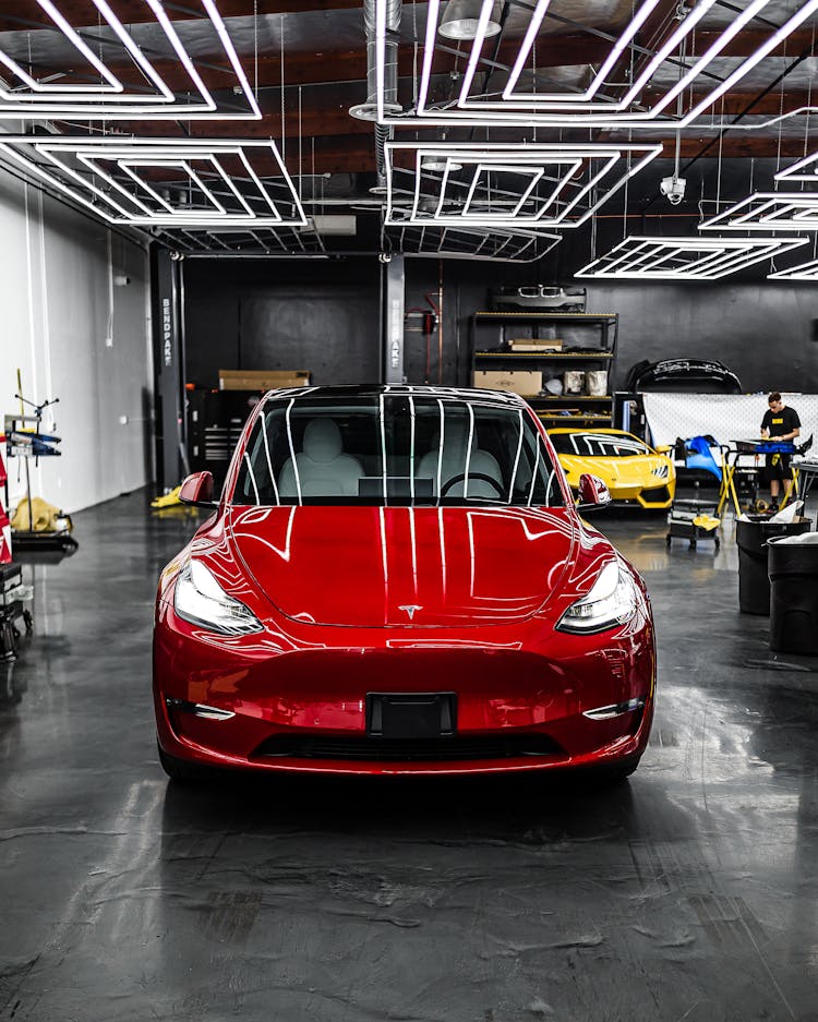 Red Car Parked In Garage