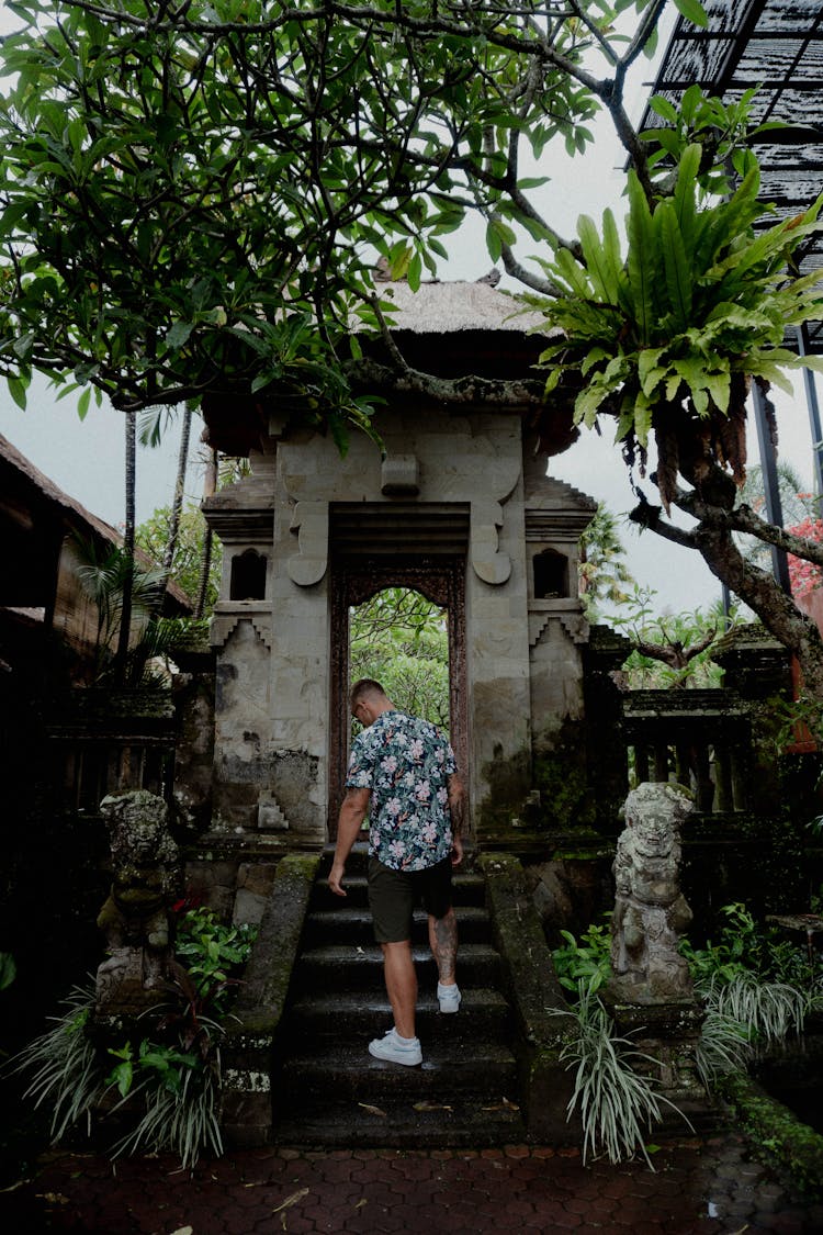 Man In Floral Polo Walking Up On Stairs 