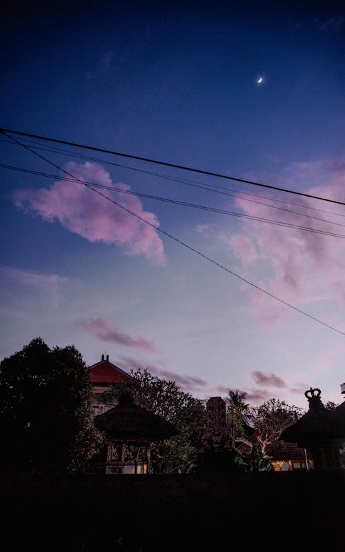Pink Clouds in Evening Sky in Village