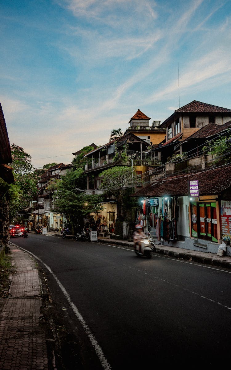 Asphalt Street Between Houses On Hills In A Tropical Town 