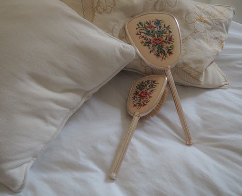 Hair Brushes on the Bed 