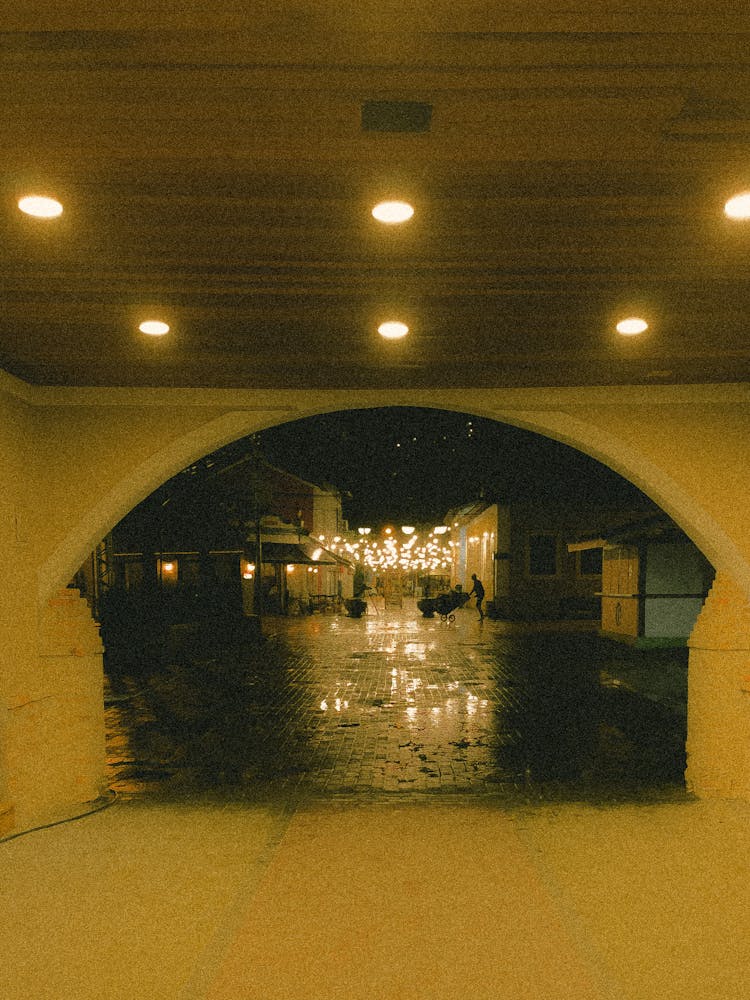 Sidewalk After Rain At Night Seen From Tunnel