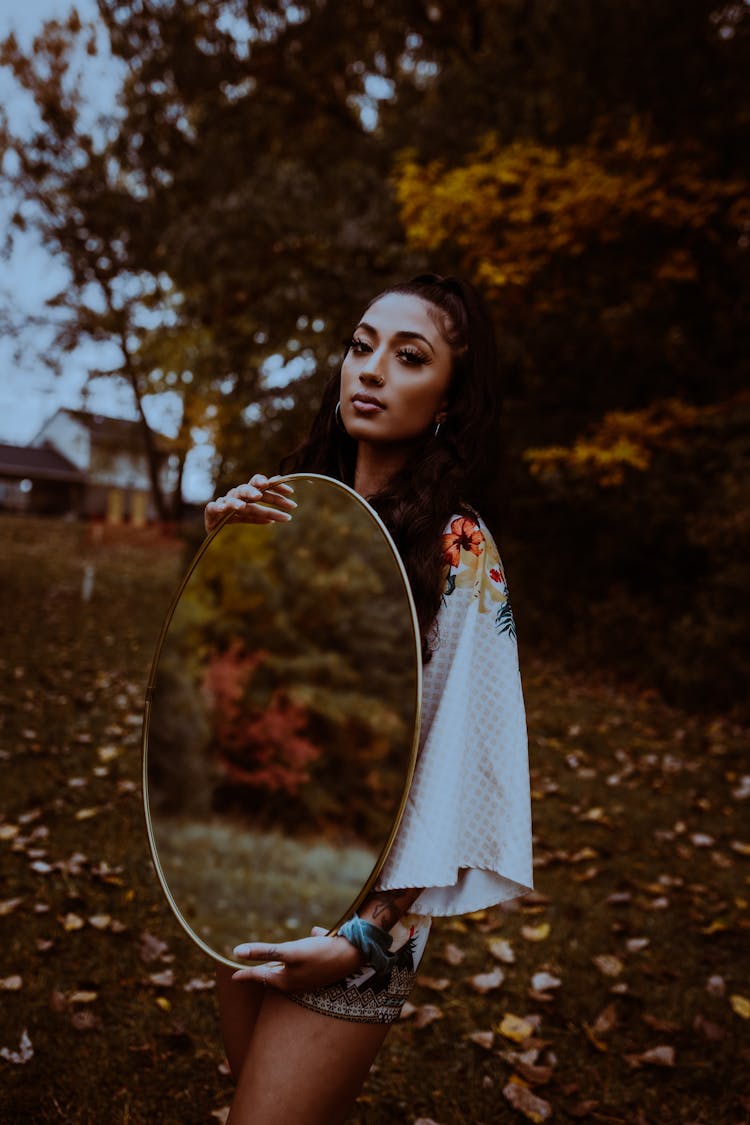 Brunette Fashion Woman Showing Mirror