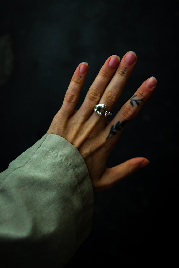 Hand With Ring And Tattoo