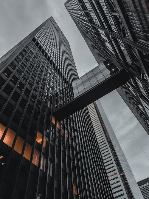 Free Modern Glass Skyscrapers against Sky Background Stock Photo