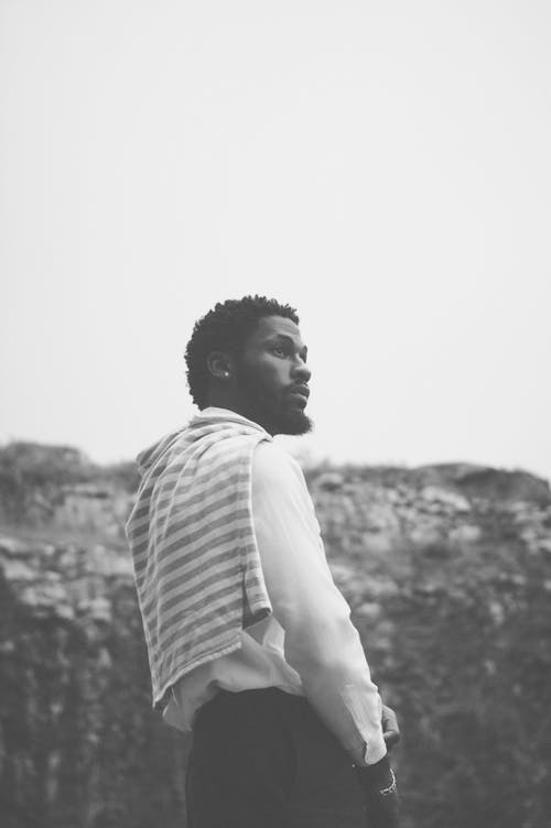 Black and White Photo of Bearded Man Looking Away