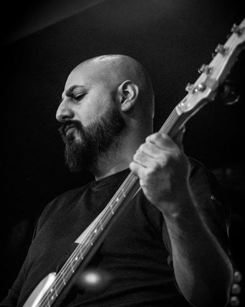 Grayscale Photo of a Bassist