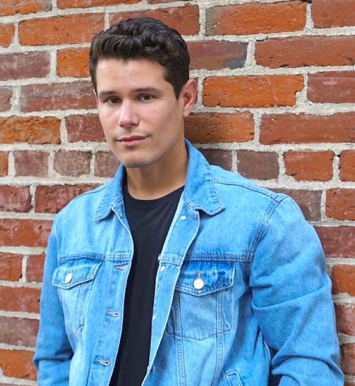 Young Man in a Denim Shirt and Black T-Shirt 