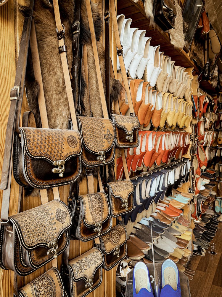 A Variety Of Bags And Shoes At A Store